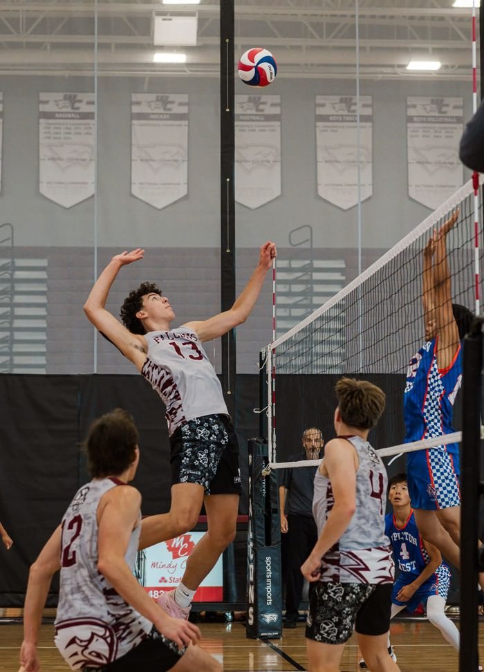 Volleyball player in mid-air, sharp